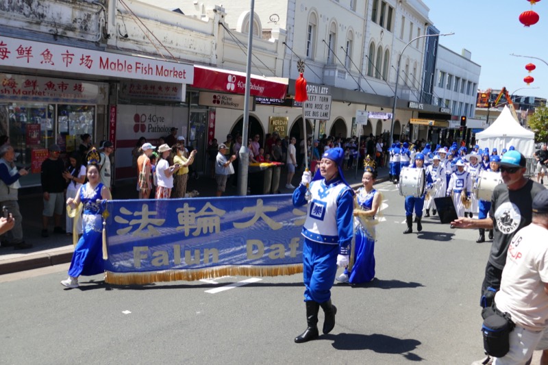 Banner bearers leading the band through the festival street