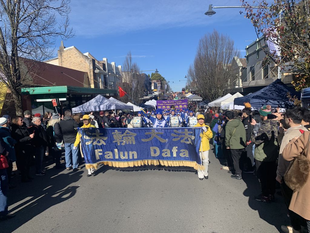 The band performing at the Blue Mountains Winter Magic Festival, framed by street crowds